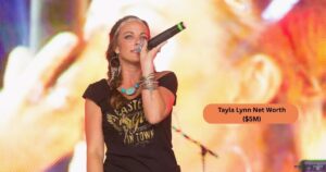 Tayla Lynn performing on stage with her guitar. Fans celebrate her country music success and achievements. Tayla Lynn Net Worth reflects her musical career and legacy.